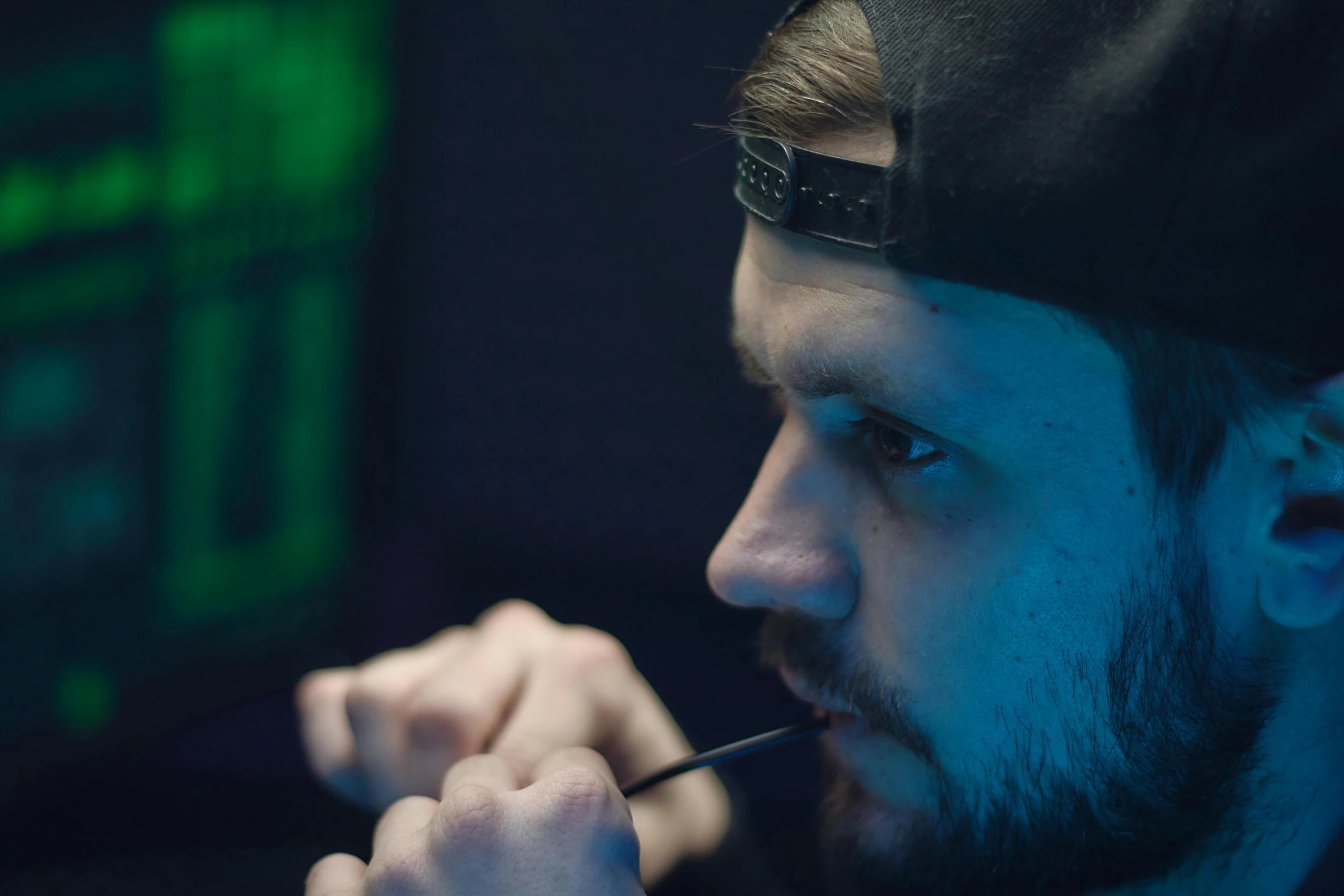 a man with a beard sitting in front of a computer, furaffinity, piercing stare, the straw is in his mouth, a close up shot