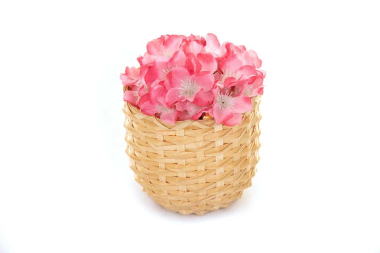 a basket filled with pink flowers on a white surface, mini model, item, less detailing, vanilla
