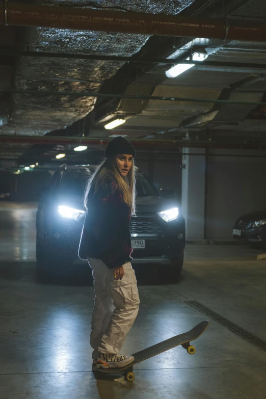 a woman riding a skateboard in a parking garage, inspired by Elsa Bleda, happening, pokimane, full view of a car, epk, intimidating stance