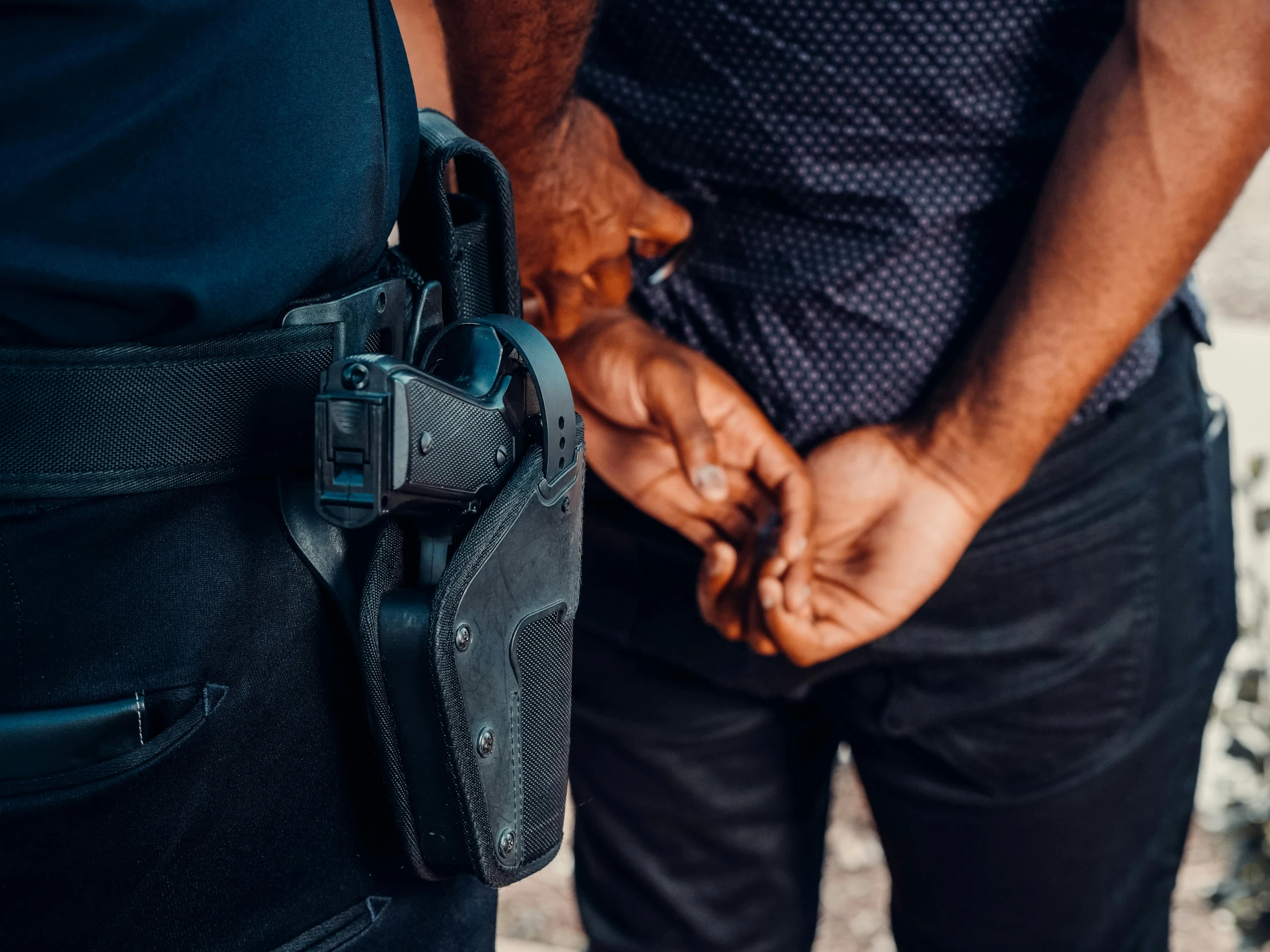 a couple of men standing next to each other, trending on pexels, arrested, holding pdw, policeman closeup, thumbnail