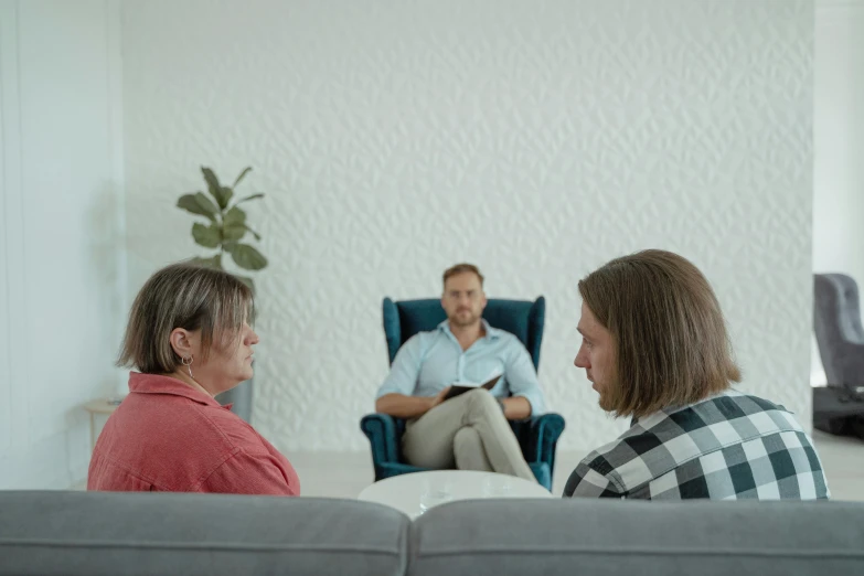 three people sitting on a couch in a living room, unsplash, hyperrealism, realistic footage, ad image, ignant, the panorama