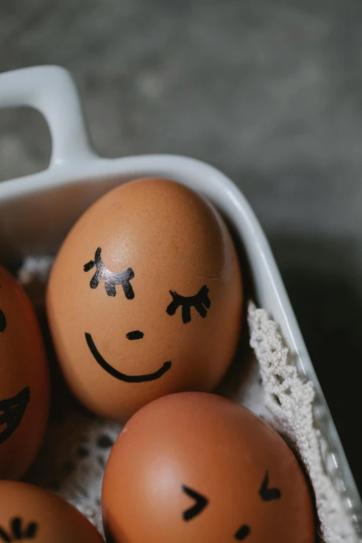 a bunch of eggs with faces drawn on them, trending on pexels, a still of a happy, morning detail, enamel, recipe