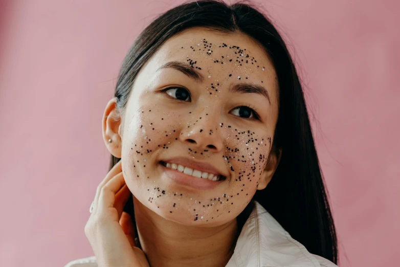 a woman with black spots on her face, trending on pexels, mingei, joy ang, lush, covered with tar, manuka