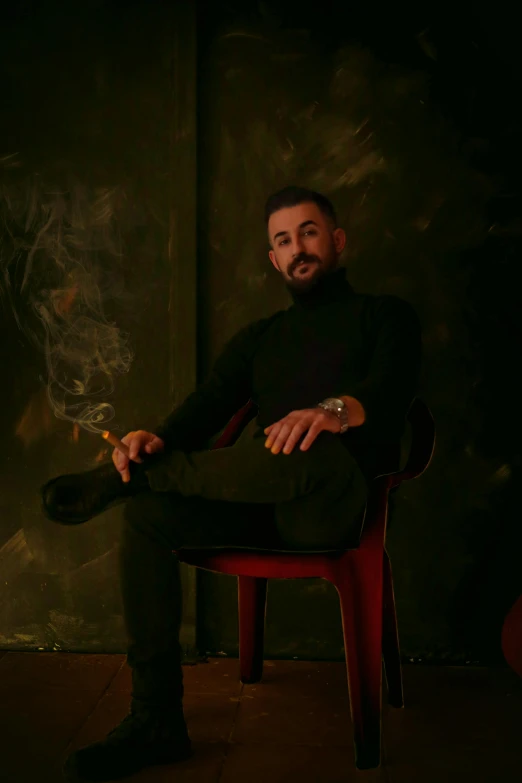 a man sitting in a chair smoking a cigarette, an album cover, inspired by Carlo Mense, pexels contest winner, mannerism, singer maluma, studio photo portrait, artem, full body within frame