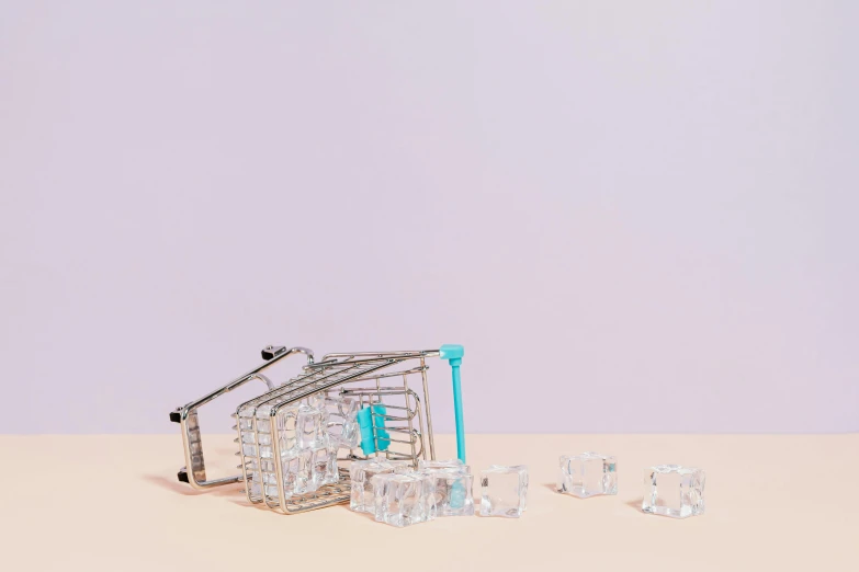 a shopping cart sitting on top of a table, crystal cubism, ice cubes, 6 pack, curated collection, mint