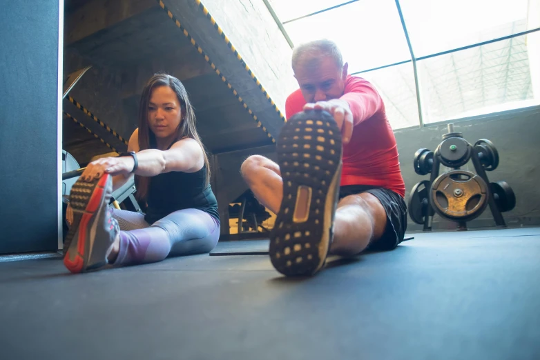 a couple of women sitting on top of a floor, in a gym, avatar image, bryan sola, stretch