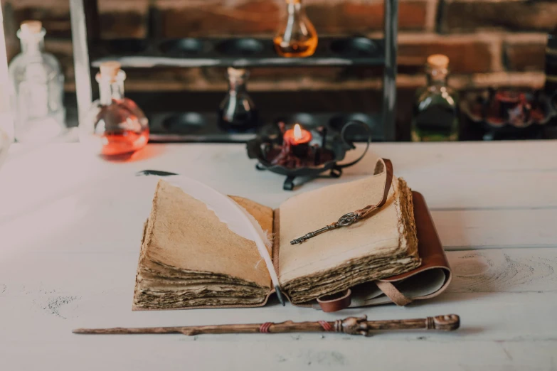 an open book sitting on top of a table, trending on pexels, private press, alchemical objects on the side, holding wands, thumbnail, parchment paper