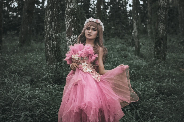 a girl in a pink dress standing in a forest, inspired by Elsa Bleda, pexels contest winner, renaissance, barbie doll, beautiful costume, concert, flower queen