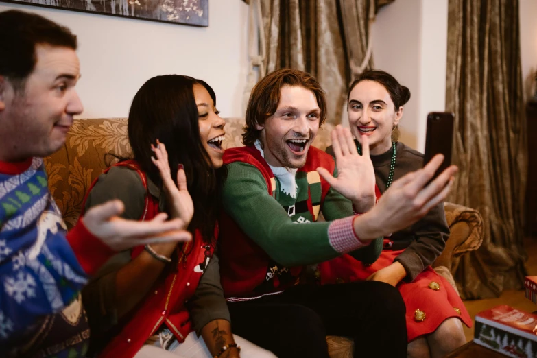 a group of people sitting on top of a couch, pexels contest winner, happening, wearing festive clothing, wearing a red gilet, avatar image, excited