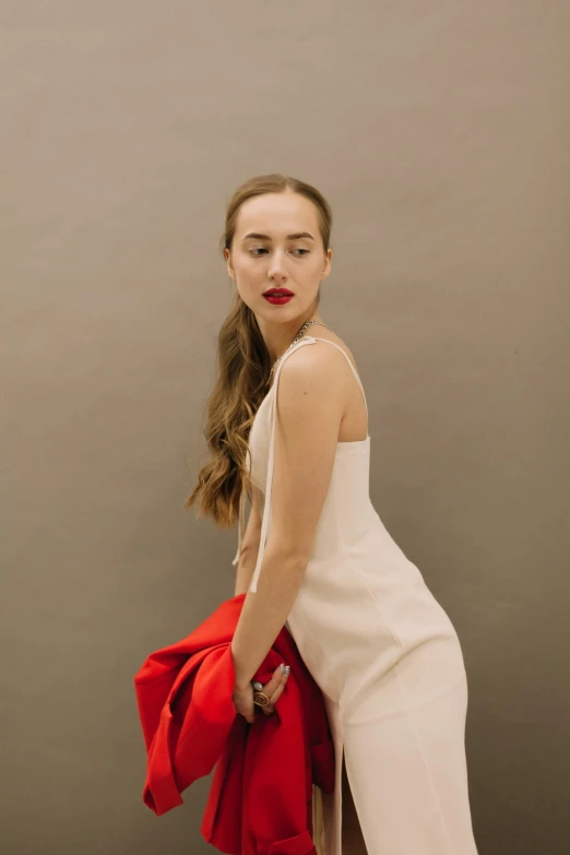 a woman in a white dress and red jacket, inspired by Clifford Ross, trending on pexels, portrait sophie mudd, 15081959 21121991 01012000 4k, britt marling style 3/4, wearing an evening gown