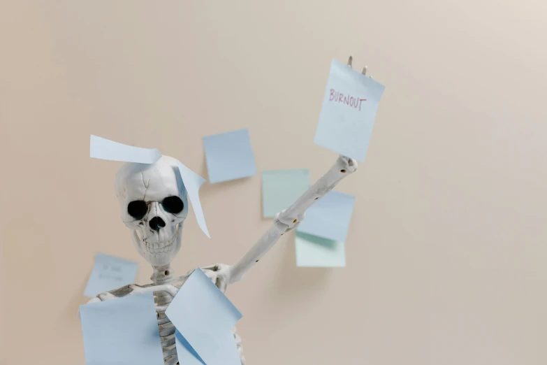 a skeleton with post it notes hanging on a wall, pexels contest winner, on a pale background, annoyed, background image, boney