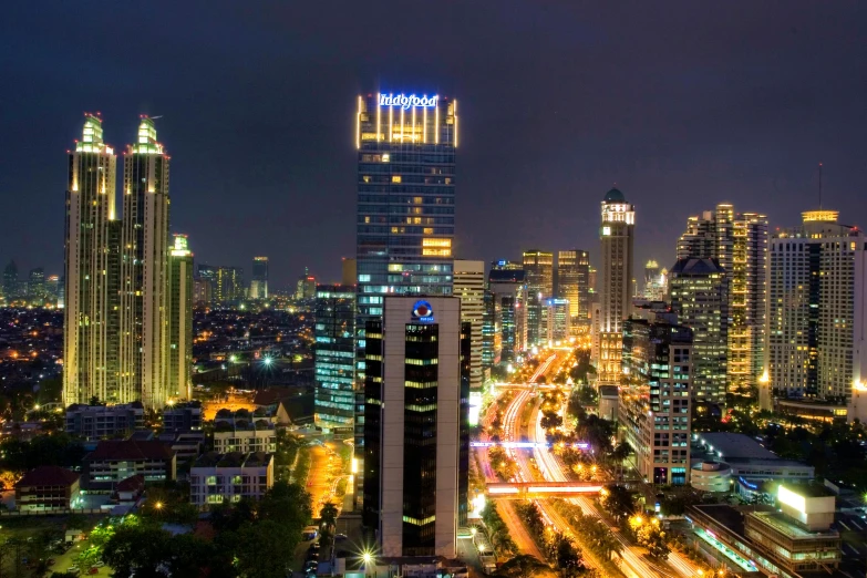 an aerial view of a city at night, by Basuki Abdullah, pexels contest winner, hurufiyya, square, high quality upload, thumbnail, corporate photo