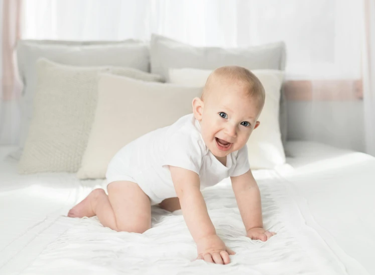 a baby crawling on a bed with white sheets, happening, smiling confidently, bowater charlie, premium quality, thumbnail