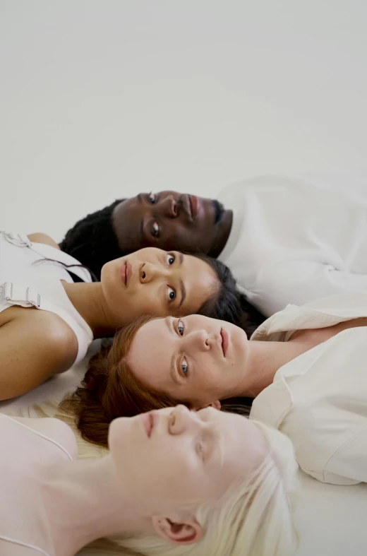 a group of people laying on top of a bed, inspired by Vanessa Beecroft, renaissance, natural complexion, issey miyake, browns and whites, profile image