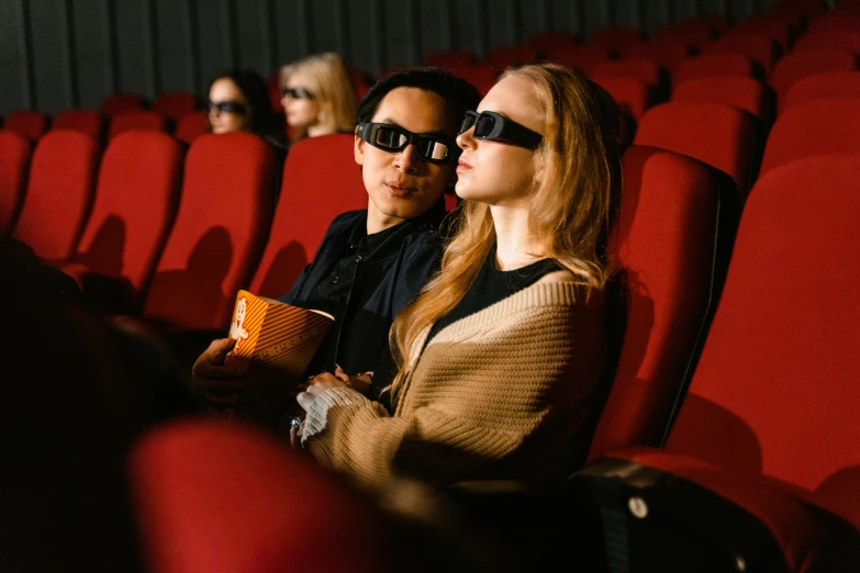 a couple of people sitting in a movie theater, trending on pexels, hyperrealism, digital sunglasses, jin shan and ross tran, russian cinema, high quality upload