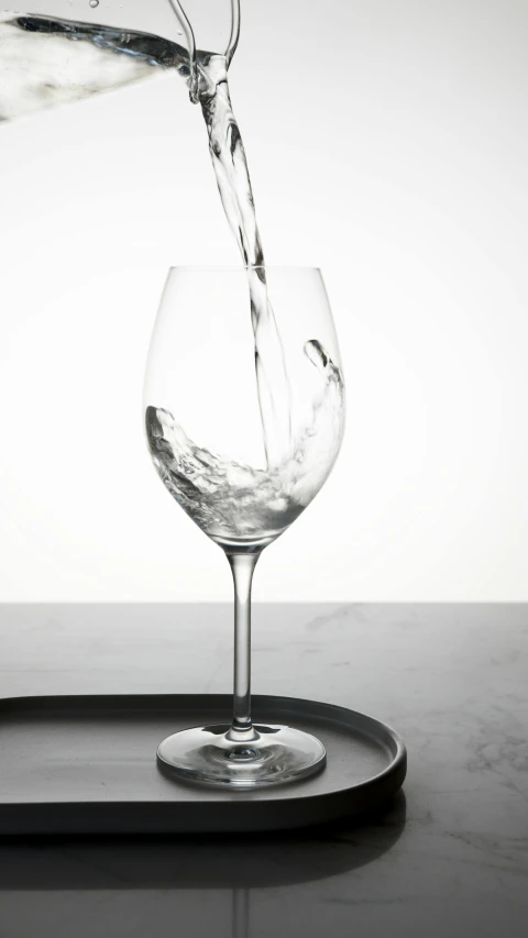 a glass of water being poured into a wine glass, by Daniel Seghers, professional product photo, hero shot, soma, 834779519