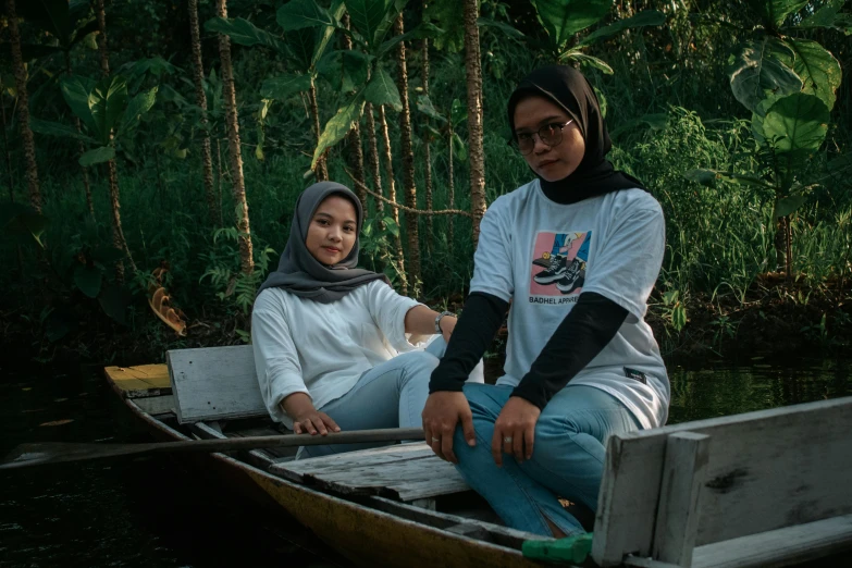 a man and a woman are sitting in a boat, a portrait, by Yosa Buson, pexels contest winner, sumatraism, outlive streetwear collection, two women, white, modest
