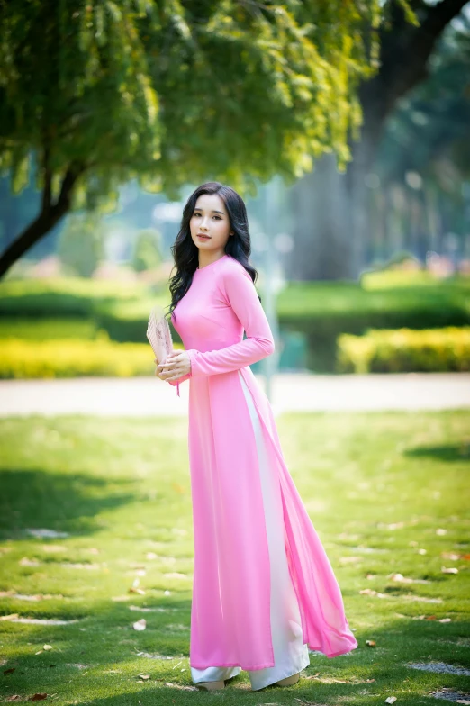 a woman in a pink dress posing for a picture, a picture, inspired by Ruth Jên, happening, ao dai, trending on imagestation, square, 1 8 yo