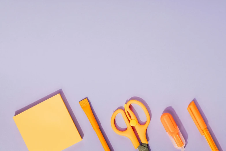 a group of office supplies sitting on top of a purple surface, inspired by Christo, trending on pexels, orange pastel colors, scissors, colors: yellow, purple neon