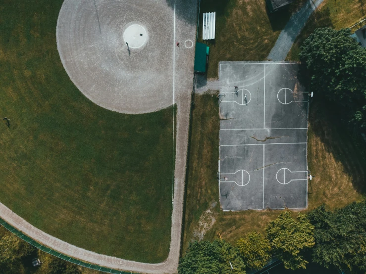 an aerial view of an empty baseball field, by Attila Meszlenyi, unsplash contest winner, from then on a basketball, at a park, helicopter view, thumbnail