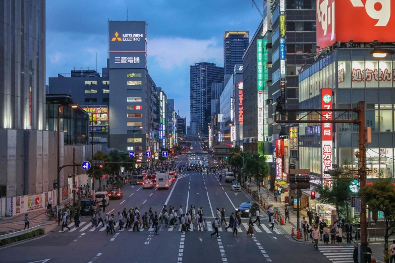 a busy city street filled with lots of people, inspired by Sōtarō Yasui, pexels contest winner, square, neon megacity in the background, ethnicity : japanese, early evening