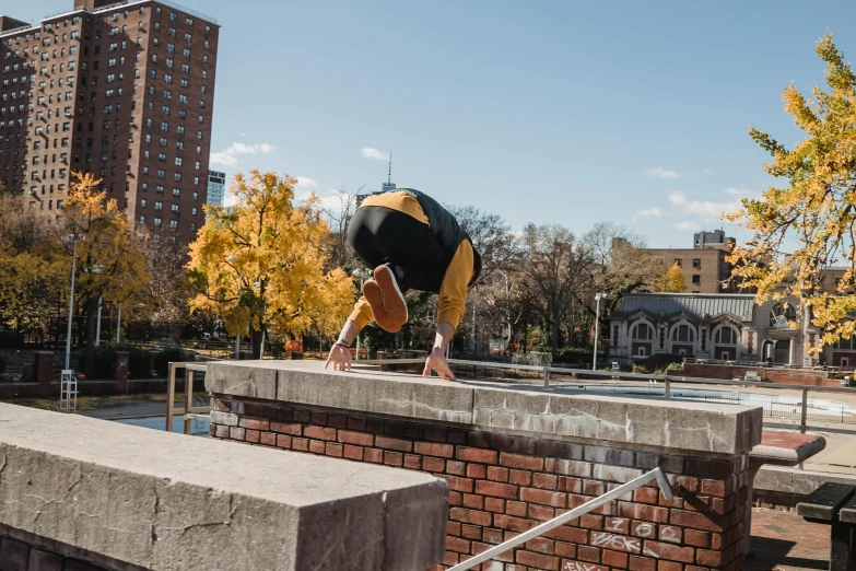 a man flying through the air while riding a skateboard, by Washington Allston, unsplash, graffiti, panoramic view of girl, parkour, mid fall, bending over