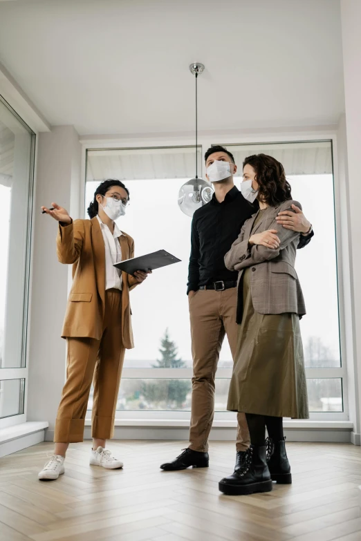 a couple of people that are standing in a room, wearing a mask, people looking at a house, professional grade, developers