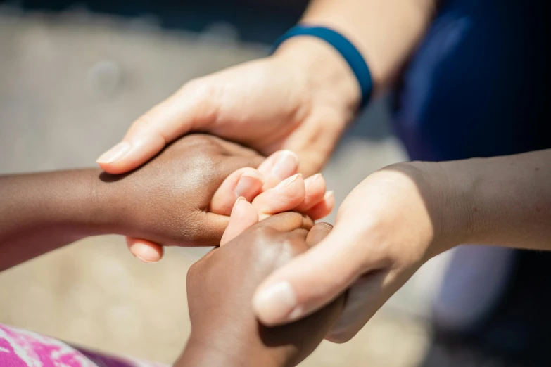 a close up of a person holding a child's hand, varying ethnicities, 15081959 21121991 01012000 4k, instagram post, bandage on arms