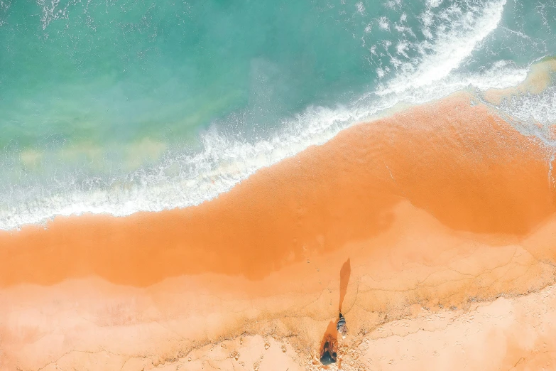 a person riding a surfboard on top of a sandy beach, pexels contest winner, minimalism, teal orange color palette 8k, birdseye view, flowing salmon-colored silk, thumbnail