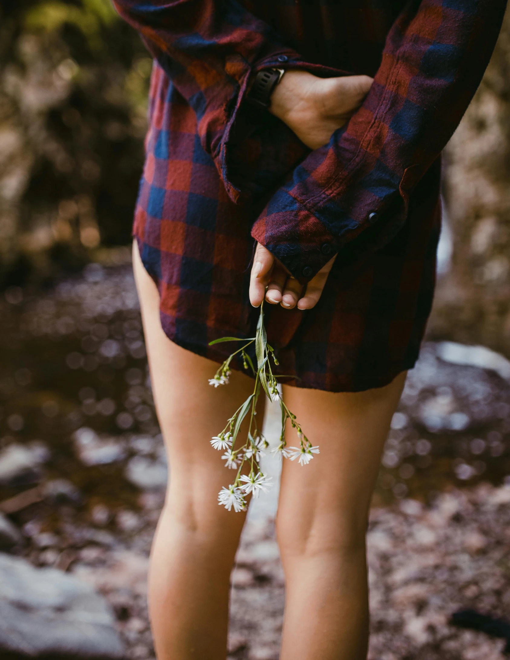 a woman in a plaid shirt holding a bunch of flowers, trending on unsplash, romanticism, no pants, dark. no text, instagram photo, instagram picture