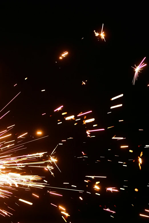 a close up of a person holding a sparkler, by Joe Stefanelli, kinetic art, steel mill, ilustration, low quality photo, falling stars