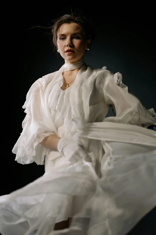 a woman in a white dress posing for a picture, an album cover, inspired by Thomas Lawrence, unsplash, wearing 1890s era clothes, fashion shoot 8k, gloves and jewelry. motion, sheer fabrics