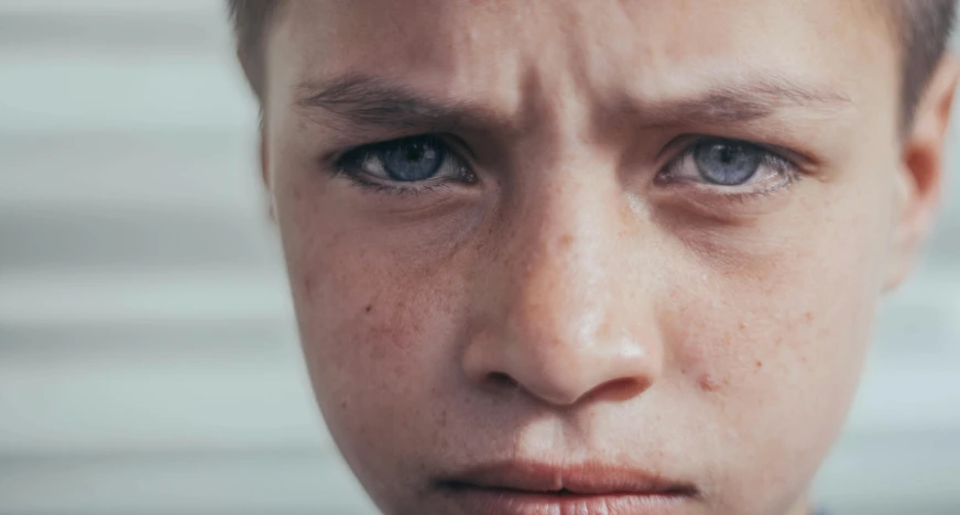 a close up of a person with a tie on, trending on pexels, hyperrealism, boy with neutral face, young angry woman, young child, with freckles