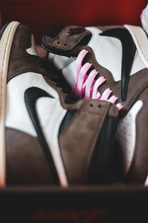 a pair of brown and white sneakers with pink laces, inspired by Jordan Grimmer, trending on pexels, renaissance, hoog detail, rapper, closeup - view, instagram picture