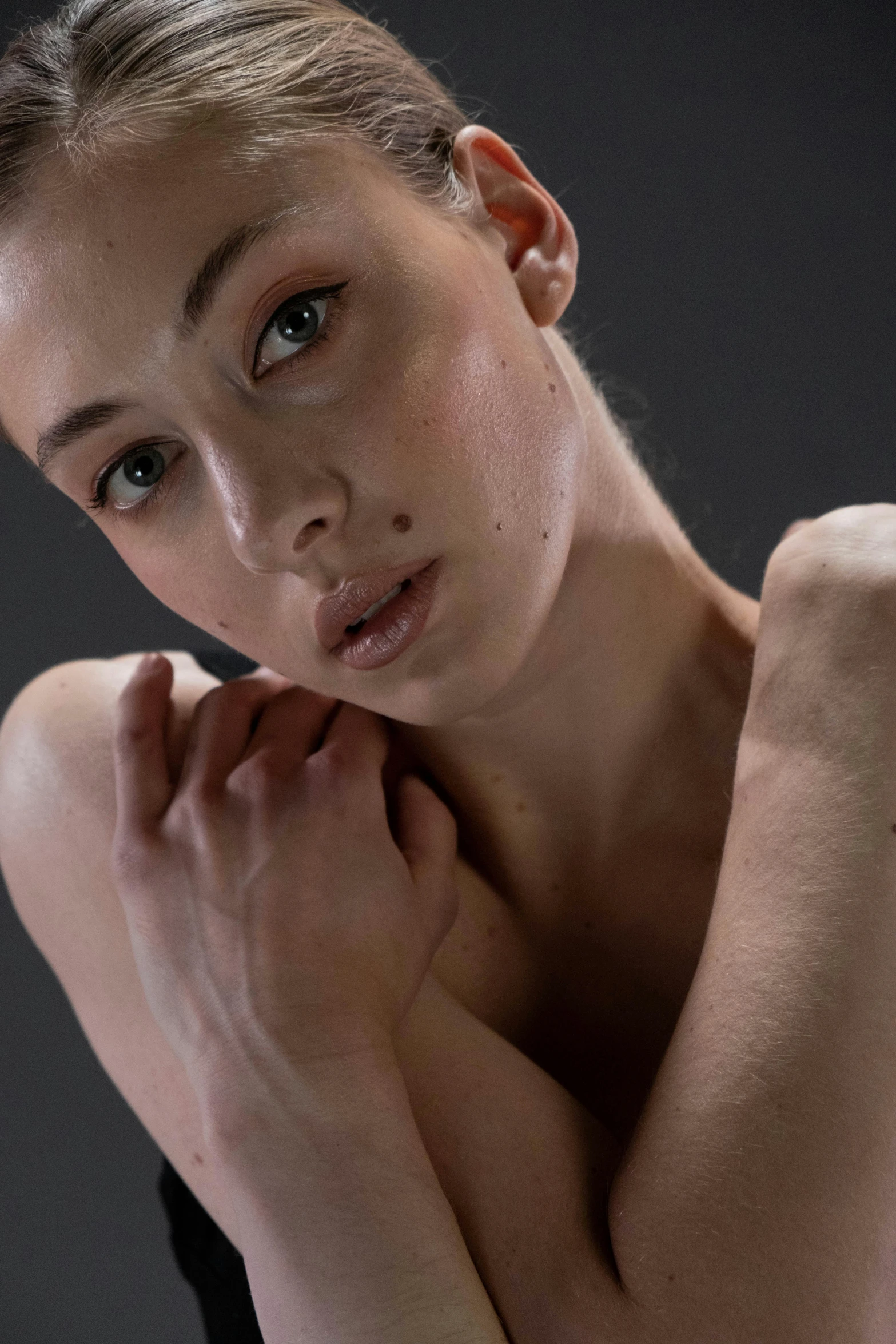 a beautiful young woman posing for a picture, inspired by Elizabeth Polunin, featured on zbrush central, hyperrealism, dewy skin, non binary model, synthetic bio skin, shot with sony alpha 1 camera