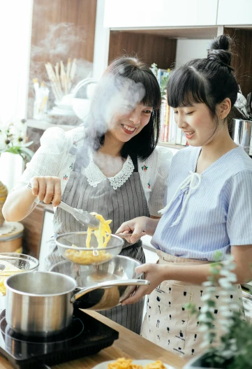 a couple of women standing next to each other in a kitchen, inspired by Yukimasa Ida, pexels contest winner, steaming food on the stove, portrait of a japanese teen, promotional image, mac and cheese