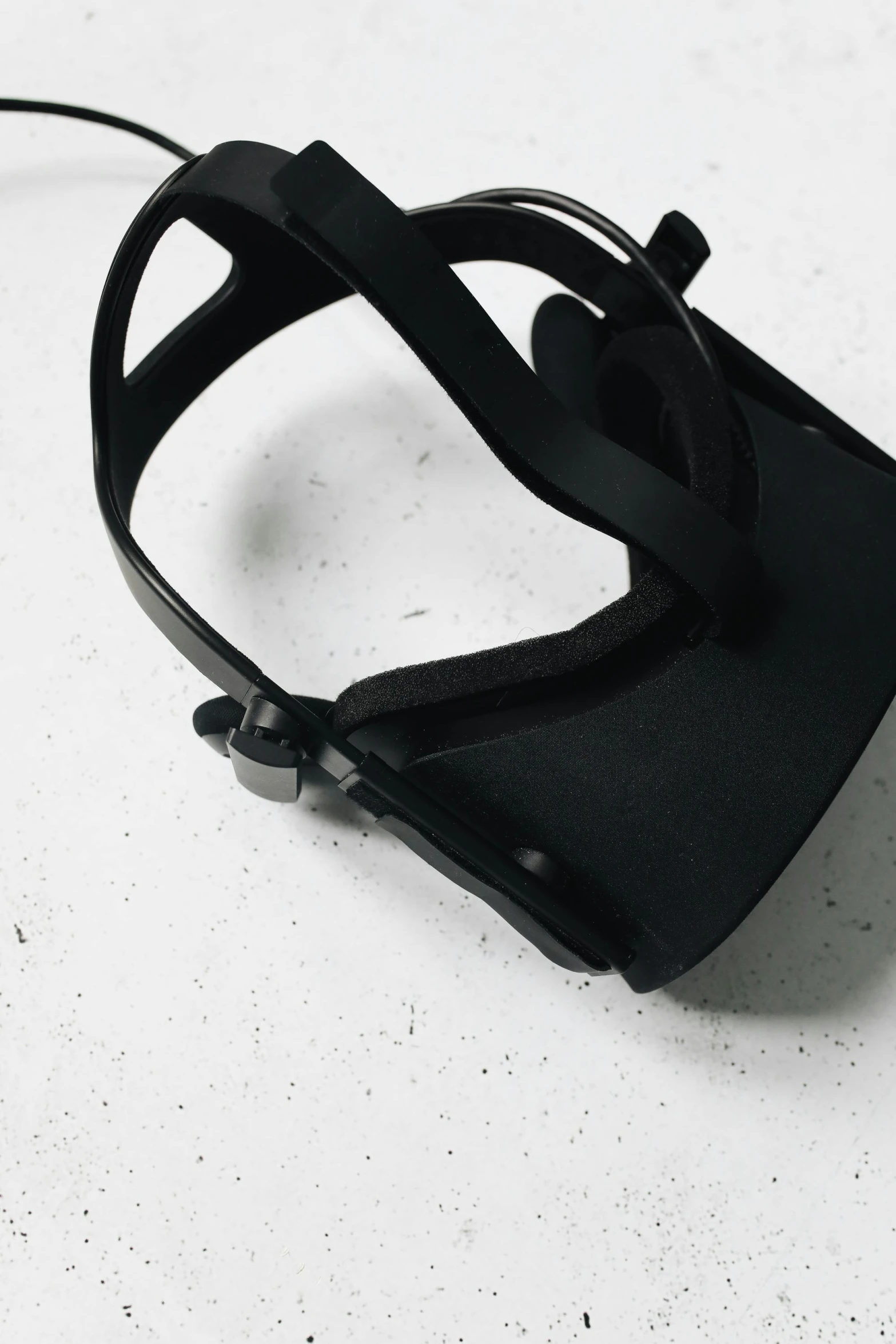 a pair of glasses sitting on top of a table, black harness, trending on r/techwearclothing, view from above, closed visor