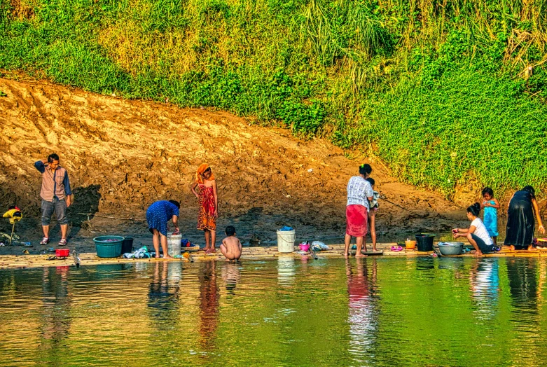 a group of people standing around a body of water, by Jan Rustem, pexels contest winner, process art, assam tea village background, hot summer sun, thumbnail, how a river