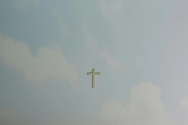 an airplane that is flying in the sky, an album cover, by Attila Meszlenyi, unsplash, minimalism, jesus on cross, rinko kawauchi, religión, silver lining