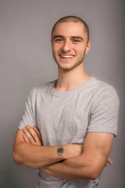 a man that is standing up with his arms crossed, a picture, slight cute smile, hasan piker, headshot and bodyshot, splash image