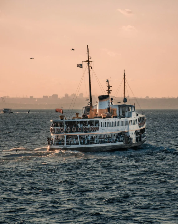 a large boat traveling across a large body of water, by Tobias Stimmer, pexels contest winner, art nouveau, lgbtq, fallout style istanbul, scandinavian, thumbnail