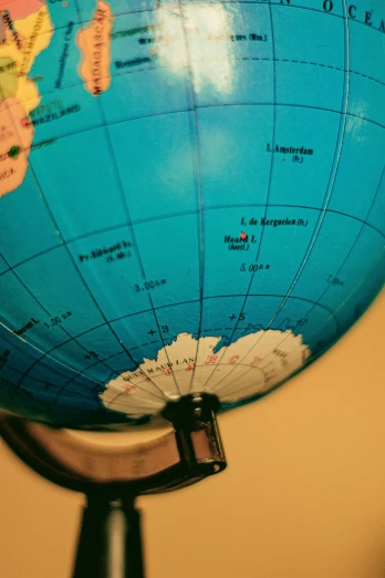 a close up of a globe on a stand