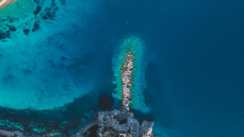 an aerial view of a large body of water, pexels contest winner, capri coast, near a jetty, blue: 0.5, portrait photo