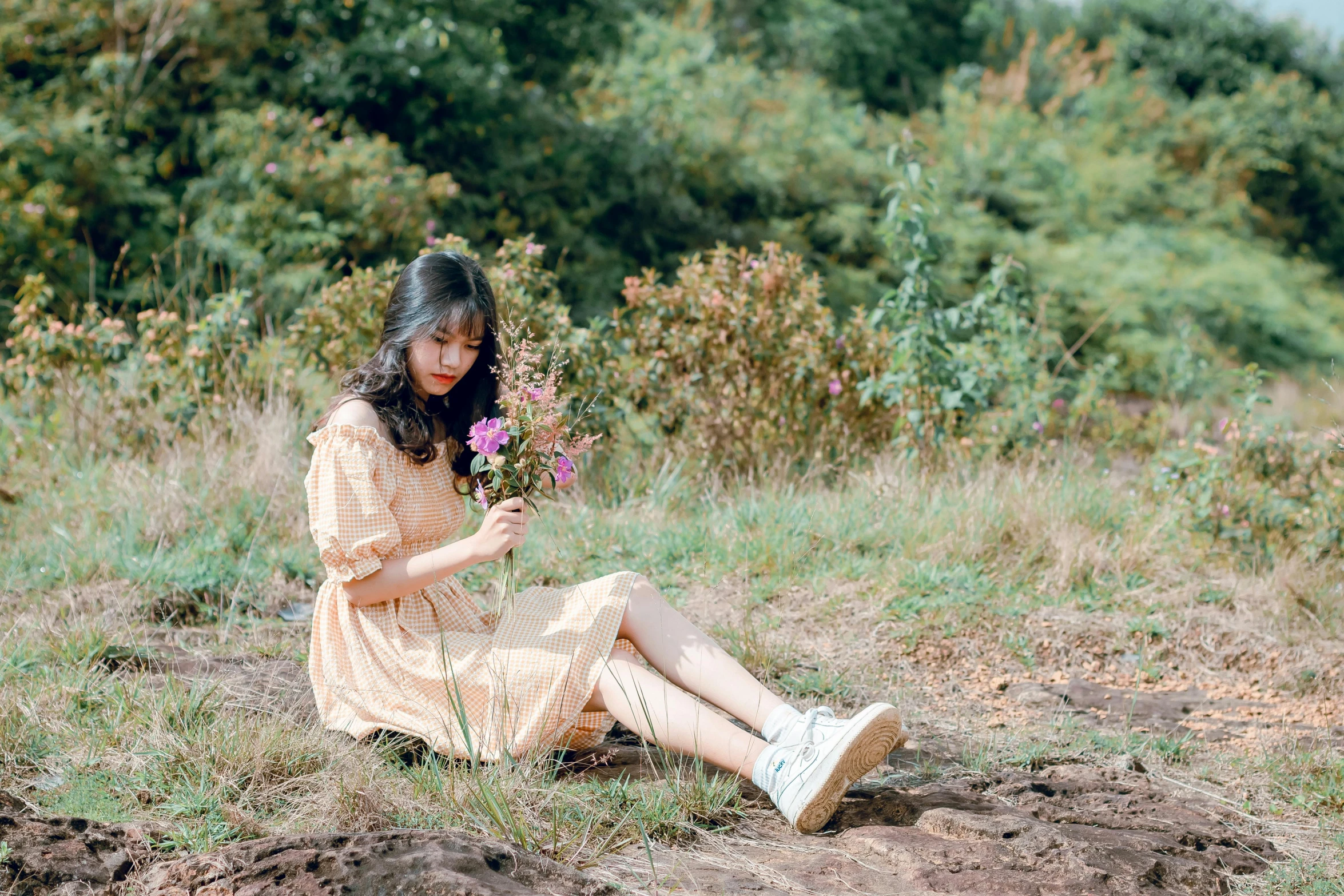 a woman sitting on the ground holding a flower, a picture, by Tan Ting-pho, unsplash, romanticism, ulzzang, wearing in a summer dress, avatar image, creamy