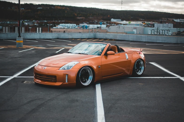 an orange sports car parked in a parking lot, a portrait, unsplash, brown, thicc build, japanese drift car, ultra nd