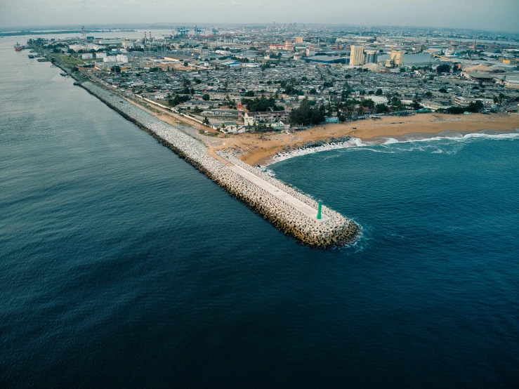 a large body of water next to a beach, by Daniel Lieske, pexels contest winner, happening, port city, sea line, plain background, surrounding the city