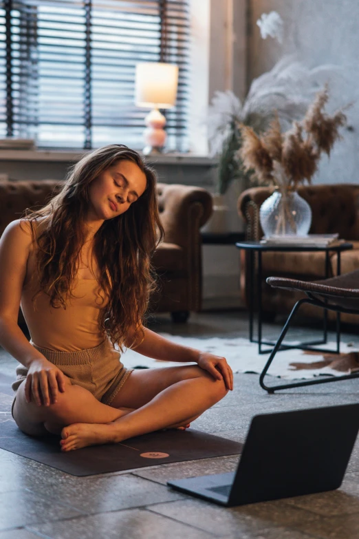 a woman sitting on the floor in front of a laptop, by Joe de Mers, unsplash contest winner, renaissance, lotus pose, beautifully soft lit, wavy hair spread out, sitting in a lounge