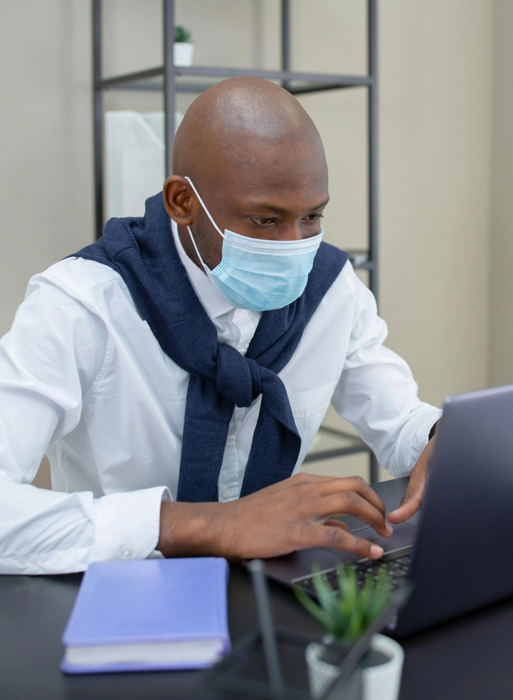 a man wearing a face mask working on a laptop, a picture, happening, corporate memphis, thumbnail, (doctor), profile image