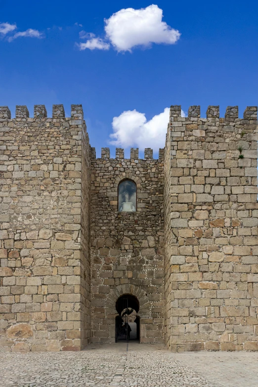 a couple of people that are standing in front of a castle, by Nadir Afonso, romanesque, wall structure, symmetrical crown, detail shot, square