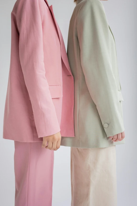 a couple of people standing next to each other, by Nina Hamnett, color field, subject detail: wearing a suit, soft blush, collection, green and pink